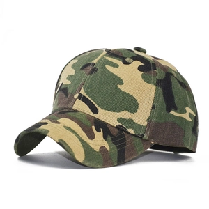 Detail view of the green jungle camouflage baseball cap with curved brim and twill texture