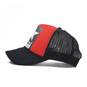 Detail of red and black trucker hat with mesh back and embroidered star patch