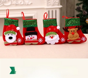 Close-up of four red Christmas stockings with 3D Santa, snowman, bear, and reindeer designs