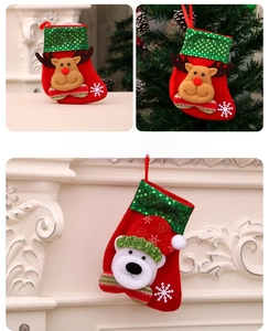 Detail of sequined Christmas stockings featuring 3D reindeer and polar bear appliques
