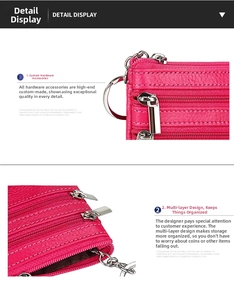 Close-up of rose red litchi grain leather coin purse with multiple silver zippers