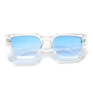 Detail shot of chunky transparent square frame sunglasses with light blue gradient lenses