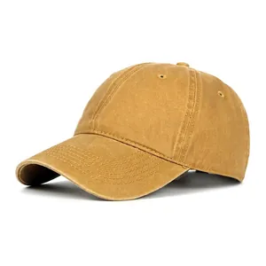 Classic washed cotton baseball cap in mustard yellow with adjustable brim and minimalist design
