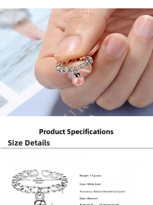 Detail view of pink strawberry quartz ring with silver heart band and size parameters