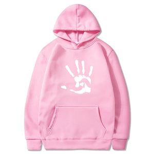 Close-up of pink fleece hoodie featuring a white palm print with a heart-shaped detail