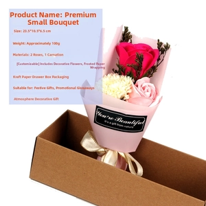 Detail view of pink soap roses and white carnation bouquet in a 23.5cm kraft gift box