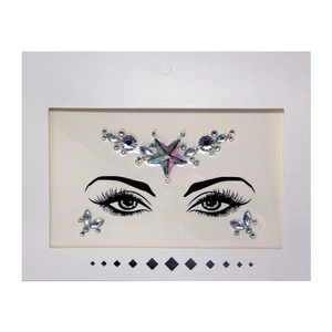 Detail of rainbow face crystal sticker with star and butterfly motifs on face template card