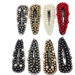 Set of 8 colorful rivet teardrop hair clips with pearls and metallic base on white
