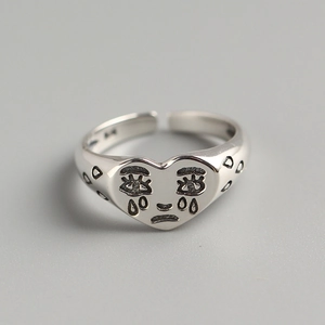 Minimalist S925 sterling silver open ring featuring a crying heart face design