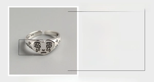 Macro detail of S925 sterling silver crying face ring with 8mm width dimensions
