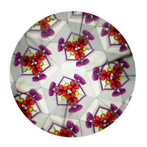Internal view of kaleidoscope showing red, purple and yellow geometric symmetry patterns