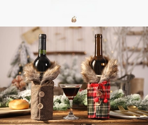 Detail of Christmas wine bottle covers with faux fur collars and plaid patterns