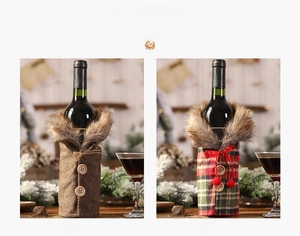 Close-up of Christmas wine bottle covers with faux fur collars and wooden button details