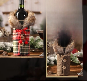Detail of Christmas wine bottle covers with faux fur collars and festive plaid patterns