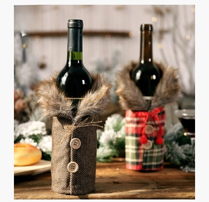 Close-up of Christmas wine bottle covers with plaid patterns and faux fur collars