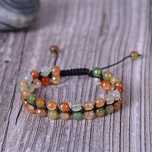 Macro detail of Bohemian double-layered faceted agate beads with black braided cord