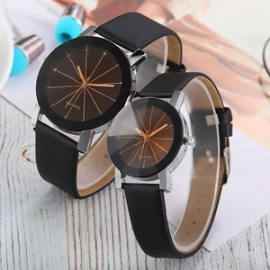 Minimalist couple's quartz watches with black leather straps and brown textured dials