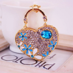 Creative gold heart handbag keychain with rhinestones and blue enamel floral accents