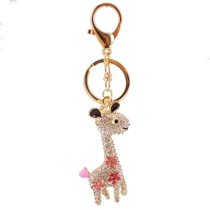 Sparkling crystal giraffe keychain in gold metal with pink rhinestone accents on white back