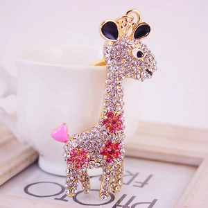 Sparkling crystal giraffe keychain in gold metal finish with pink heart detail