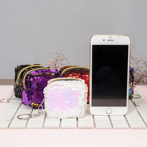 Mini sequin coin purses with flip design in white, purple, red, and black with keychains