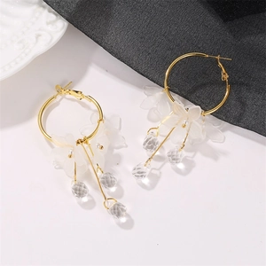Elegant gold hoop earrings with white flower petals and crystal water drop pendants