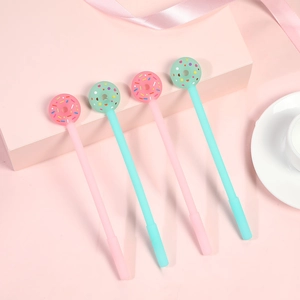 Set of four cute donut-top gel pens in soft pink and mint green colors for students