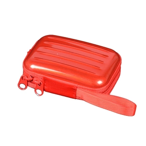 Detail of red hardshell mini storage case with suitcase texture and dual zippers