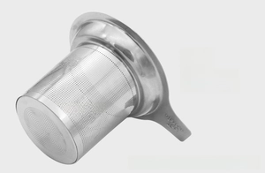 Macro detail of high-density tea infuser holes and ergonomic stainless steel handle