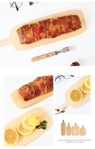 Detail of assorted natural beech wood cutting boards with handles for food serving