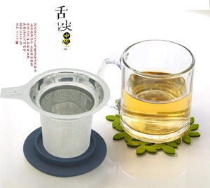 Detail of 304 stainless steel tea infuser with glass cup and blue silicone base