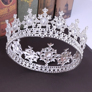 Detailed top view of silver baroque bridal crown with crystals on vintage books
