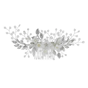 Detailed view of handmade mesh flower hair comb with silver wire, pearls, and rhinestones