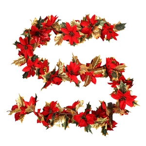 S-shaped Christmas garland with red poinsettia flowers and gold-trimmed green leaves