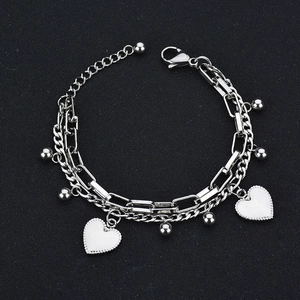 Double-layer stainless steel bracelet featuring heart pendants and silver bead charms