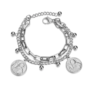 Close-up of double-layer titanium steel bracelet with tree of life and coin charms