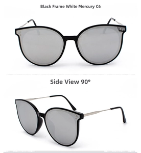 Detail view of black frame sunglasses with silver mirrored lenses and metal temples
