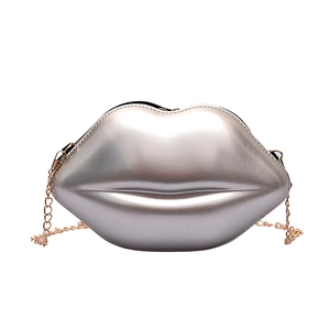 Silver lip-shaped clutch with gold chain strap, stylish chic crossbody bag for women