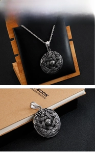Macro detail of vintage pentagram star pendant on a durable steel twisted chain necklace