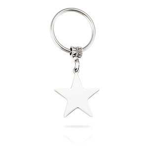 Close-up of polished stainless steel star pendant keychain on white background
