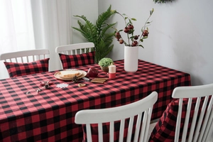 Close-up of red and black buffalo plaid table cloth with matching chair cushions