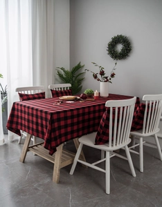 Detail view of a classic red and black buffalo plaid tablecloth and chair cushion set