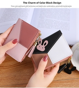 Detail of color-blocked short zipper wallets with fringe tassels and bunny charms
