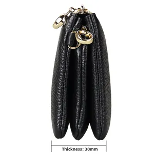 Side view of black leather accordion wallet with gold hardware and 30mm thickness detail