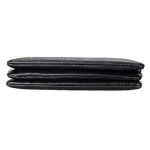 Detail shot of black leather small square bag with triple layered accordion structure