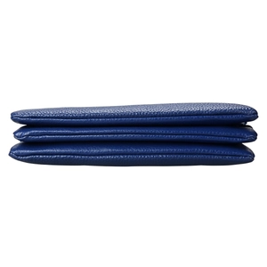 Detail view of blue lychee grain leather bag with three-layer accordion storage structure