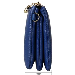 Side view of blue pebbled leather handbag showing triple compartments and 30mm thickness