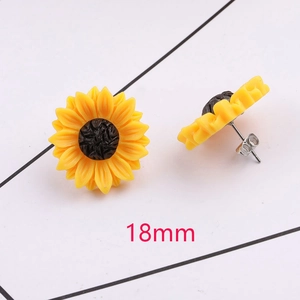 Macro shot of yellow sunflower earrings with 18mm resin petals and stainless steel posts