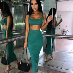 Detailed view of women's green knitted two-piece set with crop top and midi skirt