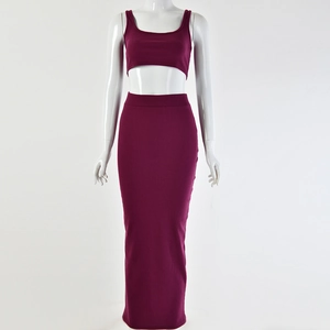 Detailed front view of burgundy ribbed knit two-piece set with crop top and maxi skirt